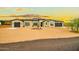 Beautiful single-story home showcasing a neutral palette, dark roof, desert landscaping, and two-car garage at 39705 N 3Rd St, Phoenix, AZ 85086