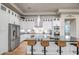 Modern kitchen with white cabinetry, stainless steel appliances, and a large center island with seating at 39705 N 3Rd St, Phoenix, AZ 85086