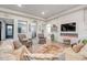 Bright living room with a fireplace, plush seating, and stylish decor, perfect for relaxation and entertaining at 39705 N 3Rd St, Phoenix, AZ 85086