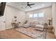 Cozy living room features a large sectional, natural light, and contemporary decor at 39705 N 3Rd St, Phoenix, AZ 85086