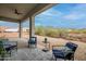 Covered outdoor patio seating area with mountain views in desert landscape at 39705 N 3Rd St, Phoenix, AZ 85086
