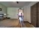 Bedroom showcasing a queen bed, minimalist decor, and access to the rest of the house at 461 W Holmes Ave # 308, Mesa, AZ 85210