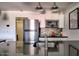 Modern kitchen featuring white cabinets, stainless steel appliances, and modern backsplash at 461 W Holmes Ave # 308, Mesa, AZ 85210