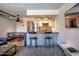 Bright kitchen featuring a breakfast bar with seating, stainless appliances, and an open dining area at 461 W Holmes Ave # 308, Mesa, AZ 85210