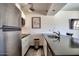 Modern kitchen featuring stainless steel appliances, white cabinets, and dark countertops at 461 W Holmes Ave # 308, Mesa, AZ 85210
