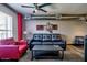 Cozy living room featuring a comfortable sofa, a stylish chair, and a modern ceiling fan at 461 W Holmes Ave # 308, Mesa, AZ 85210