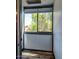 Enclosed sunroom with view of trees through an oversized window at 461 W Holmes Ave # 308, Mesa, AZ 85210