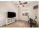 The bedroom is well-lit, featuring a ceiling fan, TV, and a small window at 4881 W Flint St, Chandler, AZ 85226