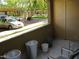 Balcony with chairs overlooking parking area and a view of community amenities at 5345 E Van Buren St # 111, Phoenix, AZ 85008