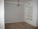 This is an empty dining room with a large window, tile floor, and an ornate chandelier at 5345 E Van Buren St # 111, Phoenix, AZ 85008