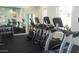 Community gym featuring modern cardio equipment, free weights, and mirrored walls for a complete workout experience at 5345 E Van Buren St # 111, Phoenix, AZ 85008