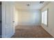 Cozy bedroom featuring neutral carpet, a window with shutters, and ample natural light at 5619 S 21St Pl, Phoenix, AZ 85040