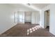 Bedroom with carpet, natural light, and a view of the neighborhood at 5619 S 21St Pl, Phoenix, AZ 85040