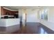 Inviting space with hardwood floors, an open-concept layout, and seamless access to the kitchen at 5619 S 21St Pl, Phoenix, AZ 85040