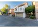 Street view of homes with attached garages, showcasing modern architecture and well-kept surroundings at 5619 S 21St Pl, Phoenix, AZ 85040