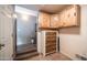 Storage room with wooden cabinets and tiled floors at 613 Ironstone Dr, Apache Junction, AZ 85119