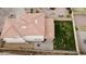 Aerial view of a home showcasing the tile roof, backyard with grass, and the outdoor patio area at 671 E Colt Ct, Chandler, AZ 85225