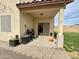 Covered patio with a barbecue grill, pavers, and an open yard for entertaining and outdoor activities at 671 E Colt Ct, Chandler, AZ 85225
