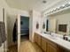 Bathroom with double sinks, carpet and view to Primary bedroom at 671 E Colt Ct, Chandler, AZ 85225