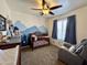 Bedroom with mountain mural, crib, changing table, grey rocking chair, and carpet flooring at 671 E Colt Ct, Chandler, AZ 85225
