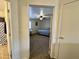 View from the doorway into the carpeted bedroom with a ceiling fan and plenty of natural light at 671 E Colt Ct, Chandler, AZ 85225