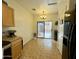 Bright dining area with tile floors, sliding glass door access to backyard, and modern lighting at 671 E Colt Ct, Chandler, AZ 85225