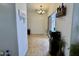 Bright dining area with tile floors, wine storage, and sliding glass doors at 671 E Colt Ct, Chandler, AZ 85225