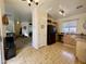 Bright kitchen with stainless steel appliances, tile floors, and access to the living room at 671 E Colt Ct, Chandler, AZ 85225