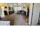 Spacious living room with neutral carpet, a staircase, and modern furnishings at 671 E Colt Ct, Chandler, AZ 85225