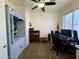 A home office with a computer setup, traditional furnishings, and a large window offering natural light at 671 E Colt Ct, Chandler, AZ 85225