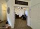 View from the hallway into a well-lit office space featuring a ceiling fan and a computer workstation at 671 E Colt Ct, Chandler, AZ 85225