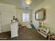 Bright playroom featuring a mirror, indoor slide and kitchen set in a carpeted space at 671 E Colt Ct, Chandler, AZ 85225