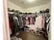 Spacious walk-in closet offering ample storage for clothes, hats and shoes at 671 E Colt Ct, Chandler, AZ 85225