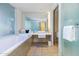 Bright and modern bathroom featuring a soaking tub, sleek vanity, and a glass shower at 6850 E Main St # 4404, Scottsdale, AZ 85251