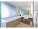 Bright and modern bathroom featuring a soaking tub, sleek vanity, and large mirror at 6850 E Main St # 4404, Scottsdale, AZ 85251