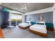 Inviting bedroom featuring two beds, stylish decor, and sliding glass doors to the balcony and outside scenery at 6850 E Main St # 4404, Scottsdale, AZ 85251
