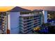 Exterior view of the hotel at dusk with mountain views, pool with lit trees, and decorative lighting at 6850 E Main St # 4404, Scottsdale, AZ 85251
