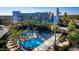 A vibrant pool area featuring lounge chairs, umbrellas, and palm trees for a tropical resort feel at 6850 E Main St # 4404, Scottsdale, AZ 85251