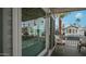Exterior porch view showcases well-maintained community, desert landscaping and palm trees at 711 Felspar Dr, Apache Junction, AZ 85119