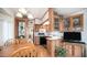 Open kitchen and dining area featuring wood cabinetry, white countertops, and modern appliances at 711 Felspar Dr, Apache Junction, AZ 85119