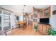 Inviting kitchen and dining area with wood cabinets and a sunlit breakfast nook overlooking the patio at 711 Felspar Dr, Apache Junction, AZ 85119