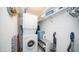 Efficient laundry area features a stacked washer and dryer, shelving, and ample storage space at 711 Felspar Dr, Apache Junction, AZ 85119