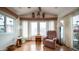 Cozy living room featuring hardwood floors, a vaulted ceiling and lots of natural light at 711 Felspar Dr, Apache Junction, AZ 85119