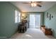 Comfortable room with natural light, ceiling fan, and access to the patio at 711 Felspar Dr, Apache Junction, AZ 85119