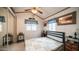 Comfortable bedroom features natural light, soft decor, ceiling fan and mirrored closet doors at 711 Felspar Dr, Apache Junction, AZ 85119