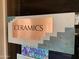 Sign for the 'Ceramics' room with rustic copper and teal design at 711 Felspar Dr, Apache Junction, AZ 85119
