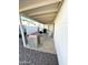 Covered patio features an outdoor kitchen with a barbecue grill, sink, and a table set for entertaining at 7754 W Mitchell Dr, Phoenix, AZ 85033