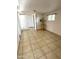Finished basement bedroom with tile floors, recessed lighting and a small window at 7754 W Mitchell Dr, Phoenix, AZ 85033