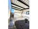 This carport features black rock landscaping and a succulent planter to add character at 7754 W Mitchell Dr, Phoenix, AZ 85033