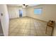 Spacious living room with tile floors, neutral walls, and ample natural light at 7754 W Mitchell Dr, Phoenix, AZ 85033